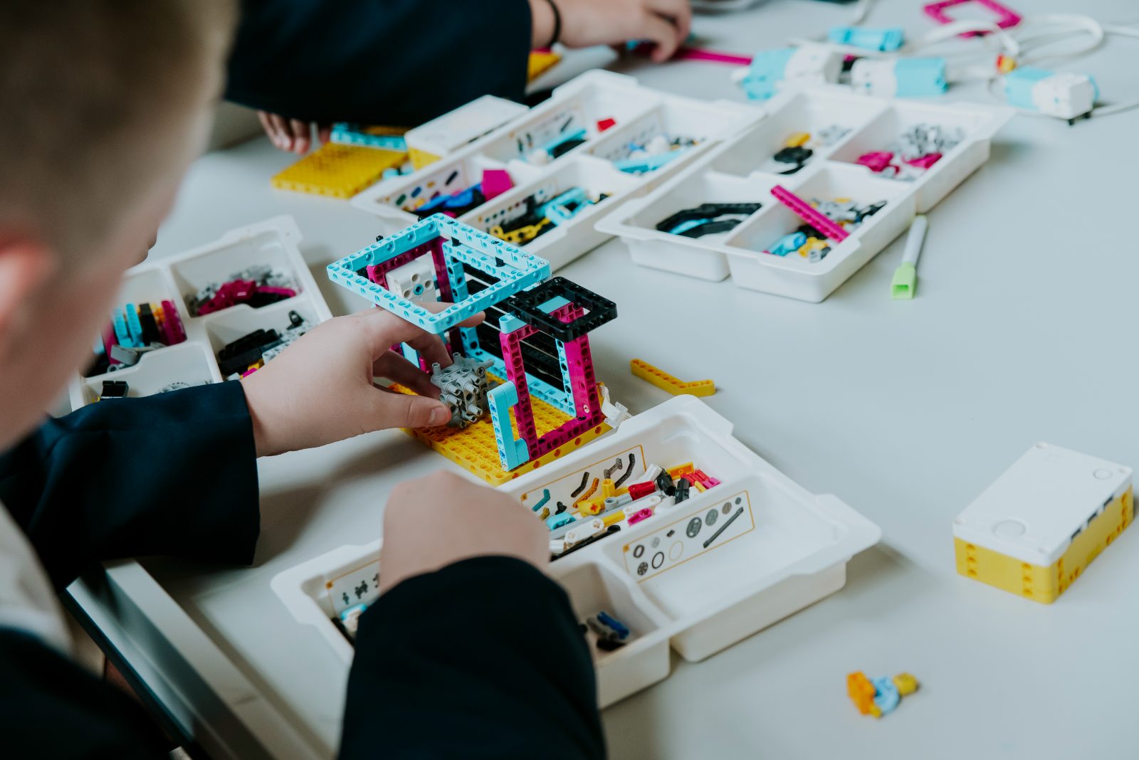 Students building with Lego Spike Prime robotics kits